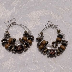 Brown beaded hoop earrings.